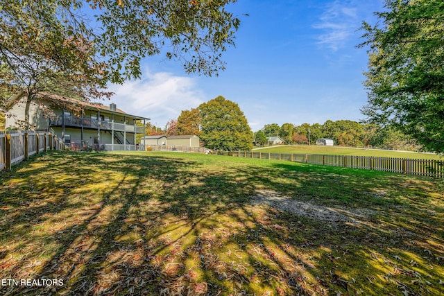 view of yard with a wooden deck