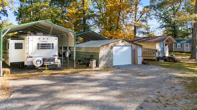 view of property exterior with a carport, a garage, and an outdoor structure