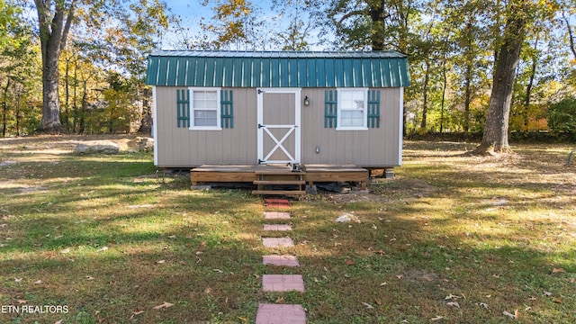 view of outdoor structure with a lawn