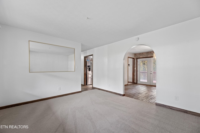 unfurnished room featuring dark hardwood / wood-style flooring