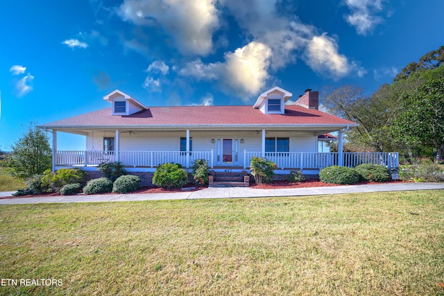 view of front of house featuring a front yard and covered porch