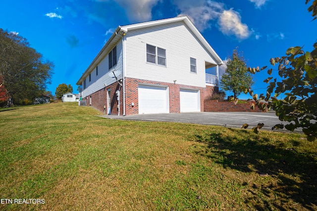 view of property exterior featuring a garage and a lawn