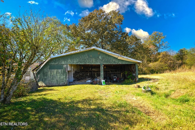 view of outbuilding with a lawn