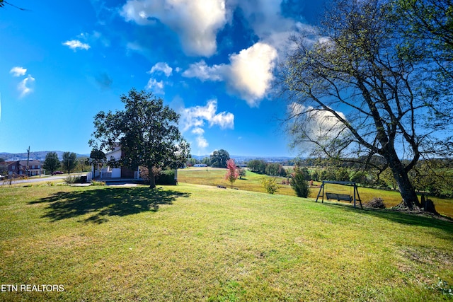 view of yard with a rural view