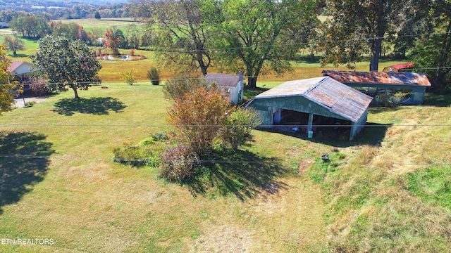 birds eye view of property with a rural view