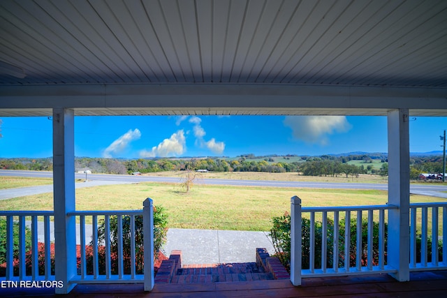 view of yard with a rural view