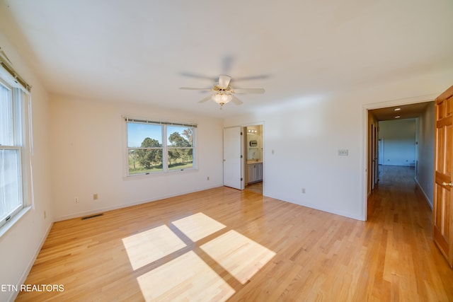 unfurnished room featuring ceiling fan and light wood-type flooring