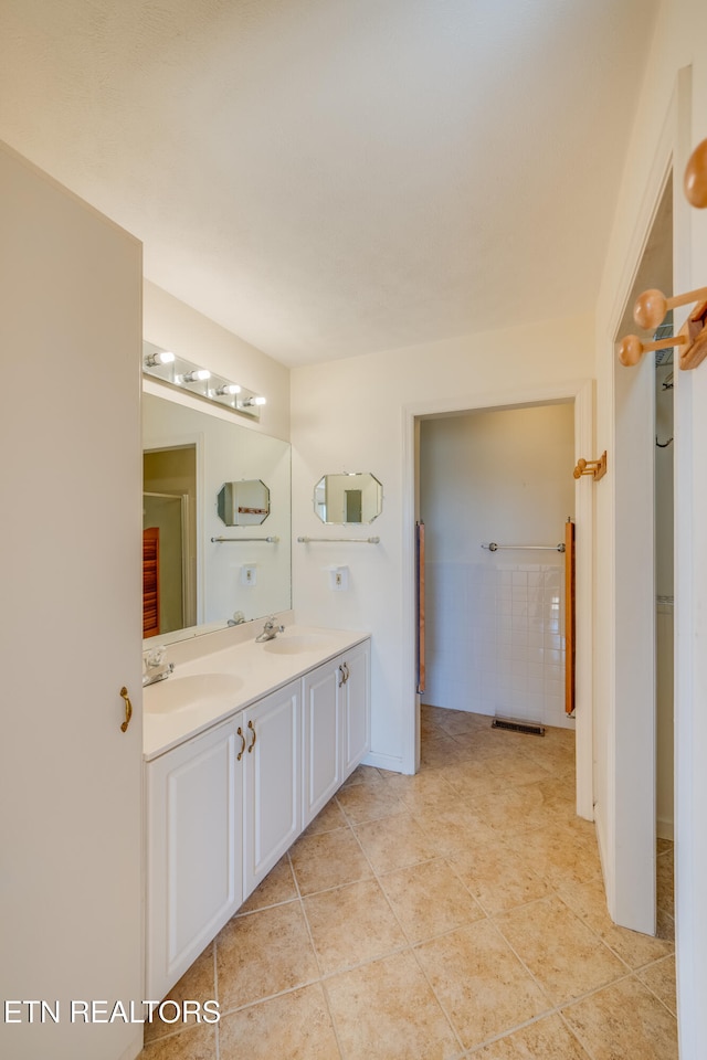 bathroom with vanity and tile patterned flooring