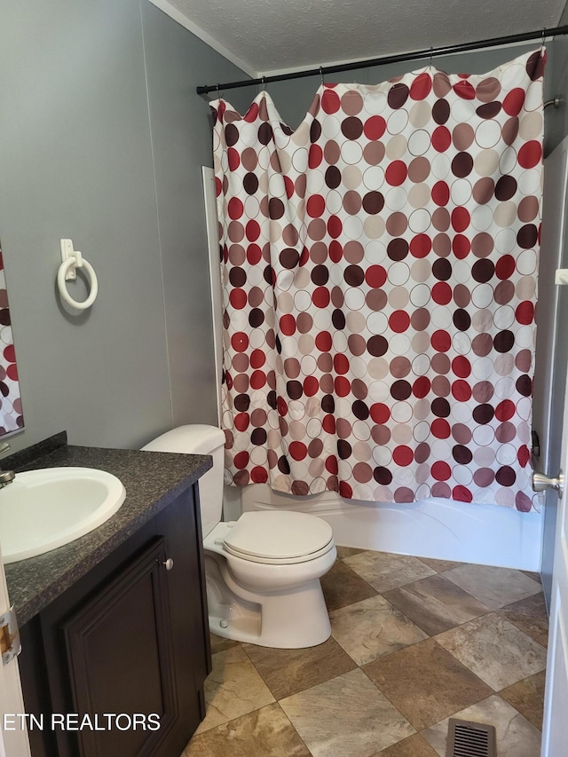 full bathroom featuring vanity, a textured ceiling, shower / bathtub combination with curtain, and toilet