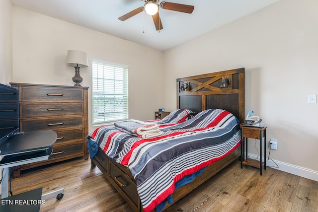 bedroom featuring ceiling fan and light wood-type flooring