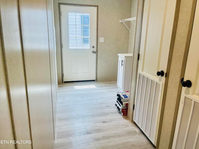 hallway with light wood-type flooring