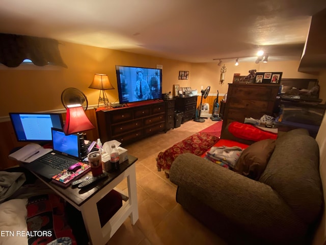 living room with rail lighting and light tile patterned flooring