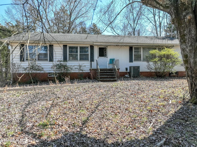 ranch-style home featuring central air condition unit and crawl space