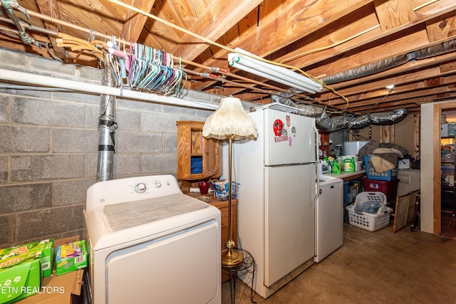 clothes washing area featuring independent washer and dryer and laundry area