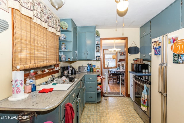 kitchen with open shelves, freestanding refrigerator, a sink, electric range oven, and black microwave