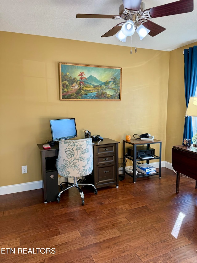 office with dark wood-type flooring, a textured ceiling, and ceiling fan