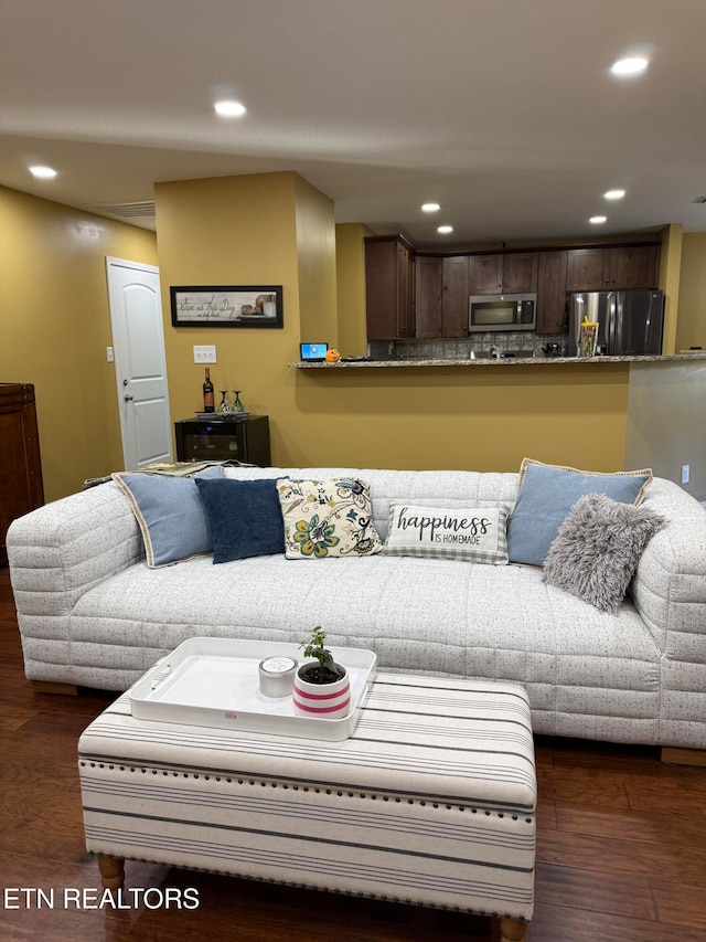 living room with dark hardwood / wood-style floors