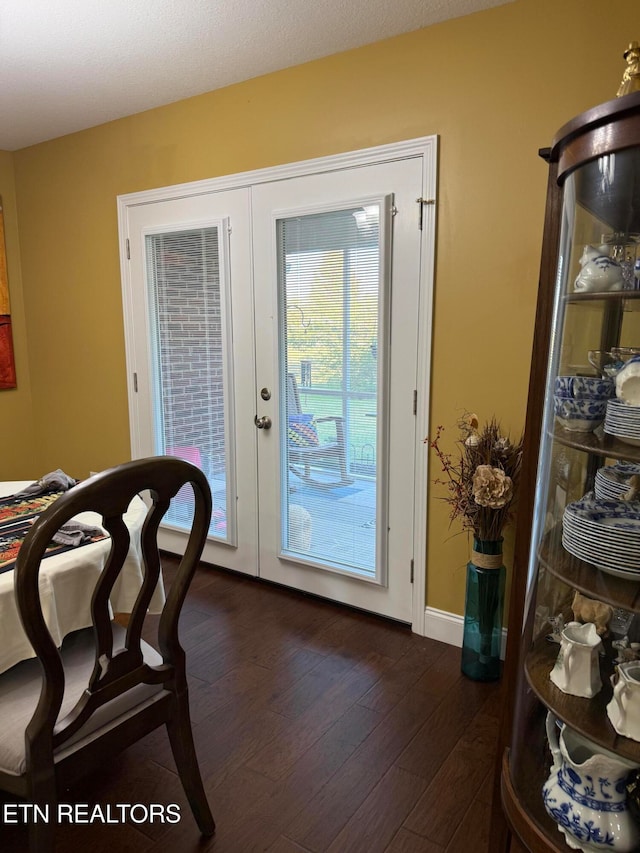 entryway with french doors and dark hardwood / wood-style floors