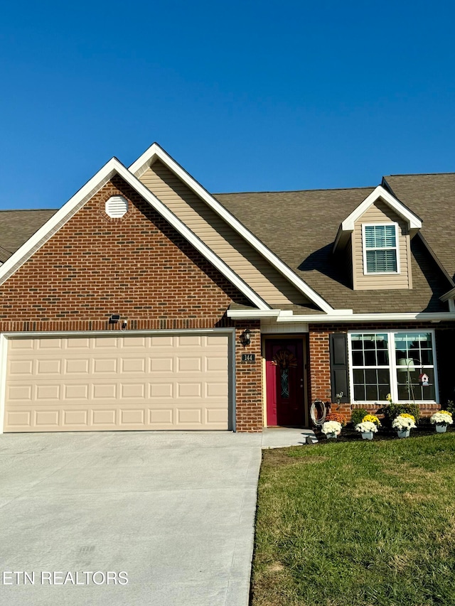 view of front facade featuring a garage and a front lawn