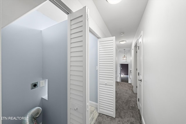 hallway featuring dark colored carpet