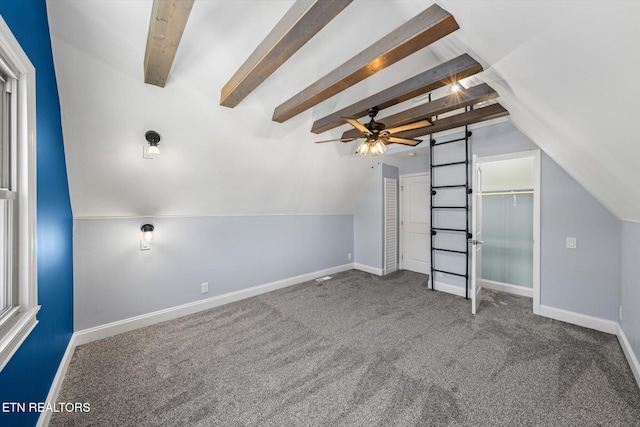 bonus room featuring carpet floors and lofted ceiling with beams