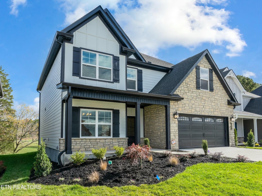 view of front facade featuring a garage and a front lawn