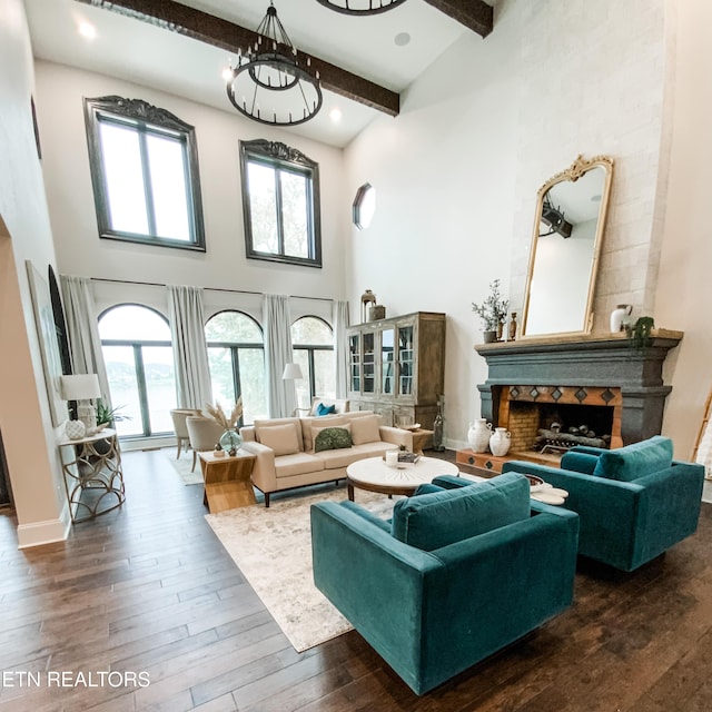 8719 Inlet Dr, Knoxville, TN 37922 - living area with a high ceiling, beamed ceiling, dark wood-style floors, plenty of natural light, and a fireplace