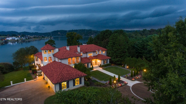 birds eye view of property with a water view