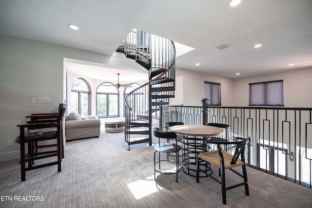 dining space with carpet flooring