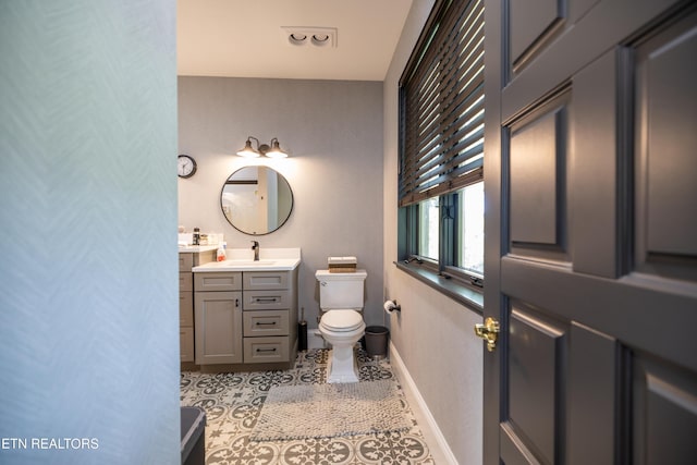 8719 Inlet Dr, Knoxville, TN 37922 - bathroom featuring toilet, vanity, baseboards, and tile patterned floors