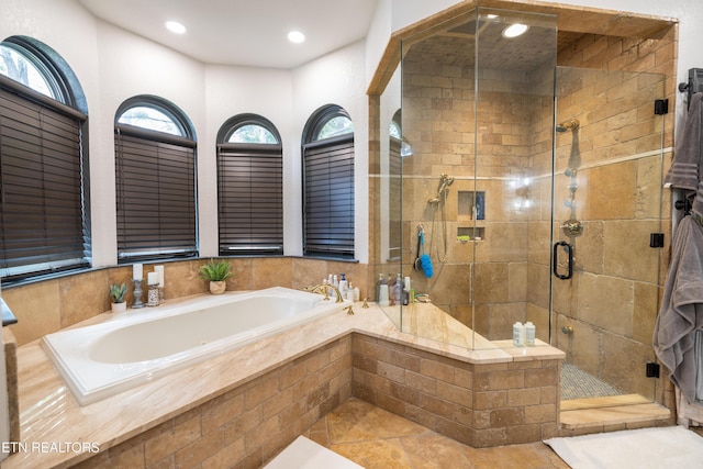 8719 Inlet Dr, Knoxville, TN 37922 - bathroom featuring a bath, a stall shower, tile patterned flooring, and recessed lighting