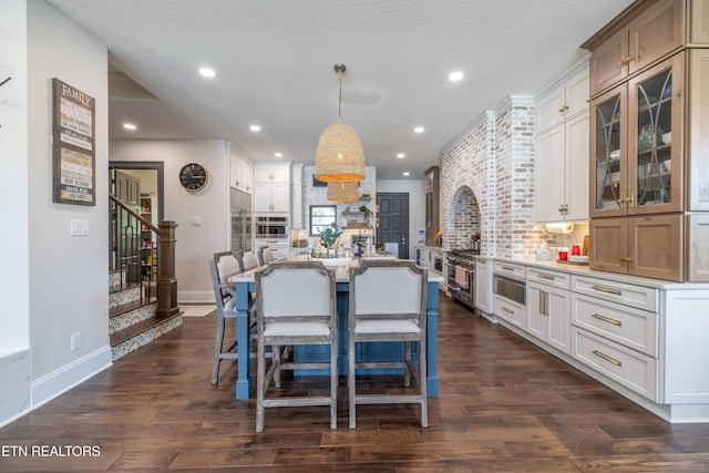 8719 Inlet Dr, Knoxville, TN 37922 - dining room featuring baseboards, stairs, dark wood-style flooring, recessed lighting, and a textured ceiling