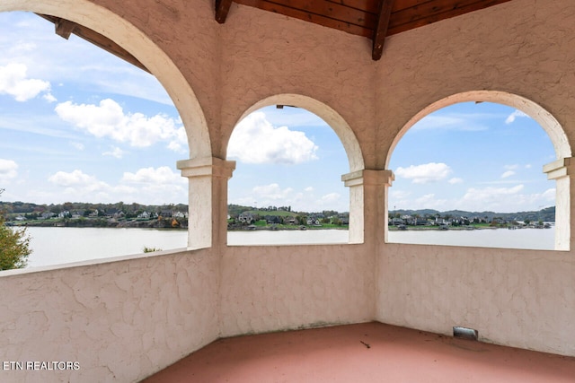 view of patio featuring a water view