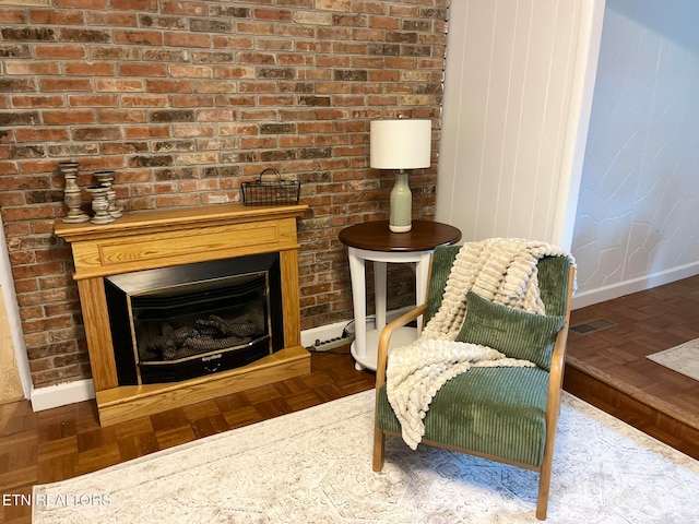 sitting room with dark parquet flooring