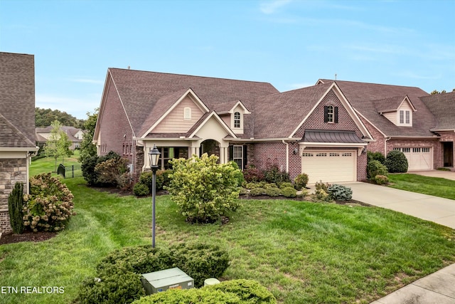 view of front of house featuring a garage and a front lawn