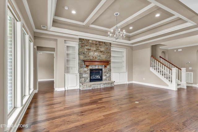 unfurnished living room with ornamental molding, dark wood-type flooring, and built in features