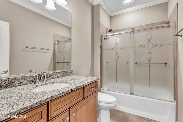 full bathroom featuring tile patterned floors, toilet, crown molding, vanity, and combined bath / shower with glass door