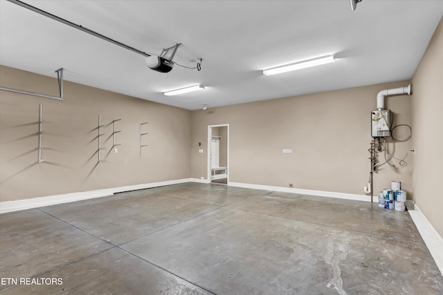 garage featuring a garage door opener and water heater