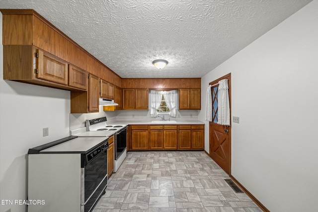 kitchen with a textured ceiling, sink, black dishwasher, and electric stove