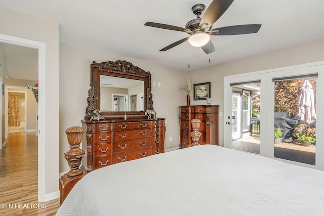 bedroom featuring access to outside, hardwood / wood-style floors, and ceiling fan