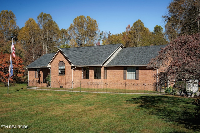 single story home featuring a front lawn