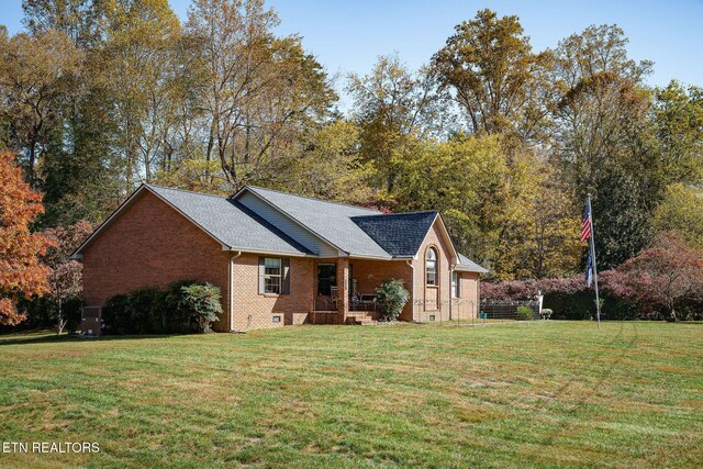 view of side of property with a yard