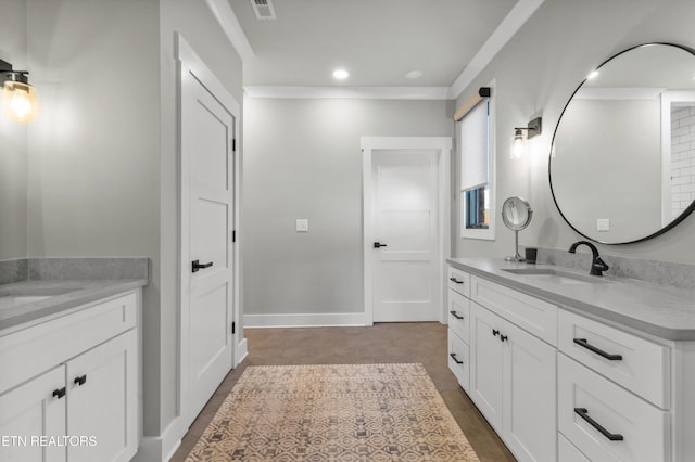 bathroom with wood-type flooring, vanity, and ornamental molding