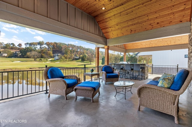 view of patio / terrace with a water view and an outdoor bar