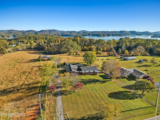 aerial view featuring a water and mountain view and a rural view