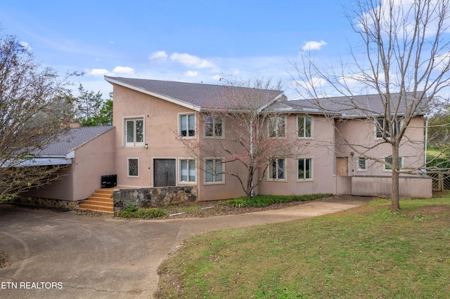 exterior space with a front lawn