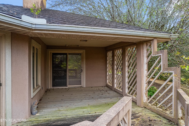 entrance to property with a wooden deck