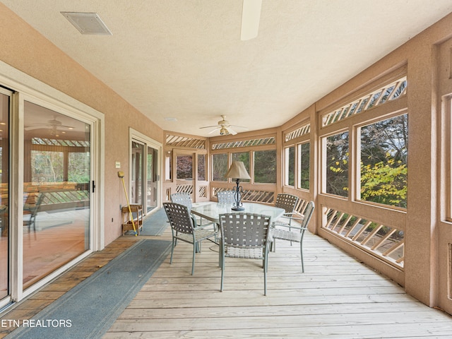 sunroom featuring a wealth of natural light and ceiling fan