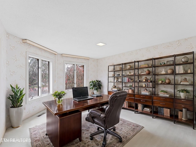 office area featuring a textured ceiling