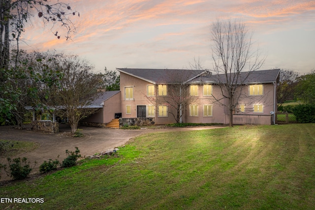 view of front of home featuring a yard